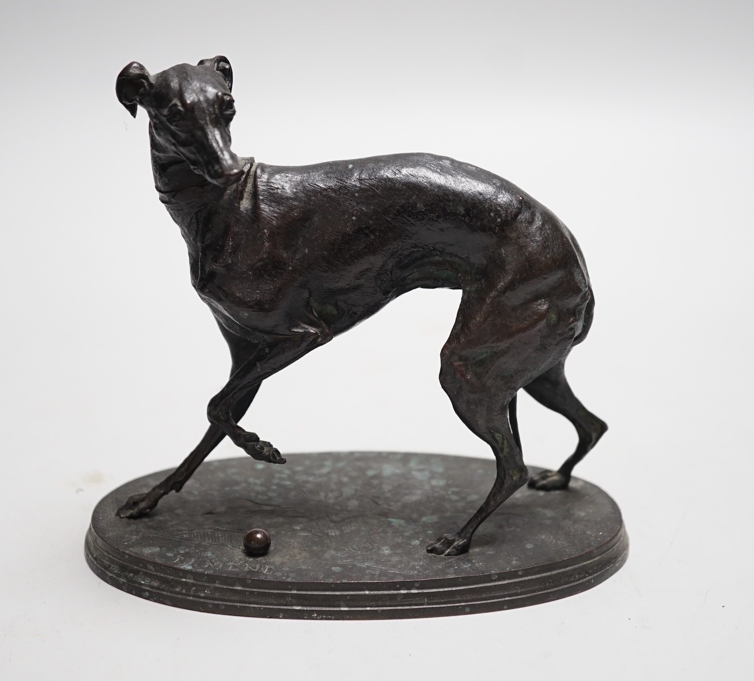 After Pierre-Jules Mene, A bronze study of a whippet, signed to underside, 17cm wide, 15cm high